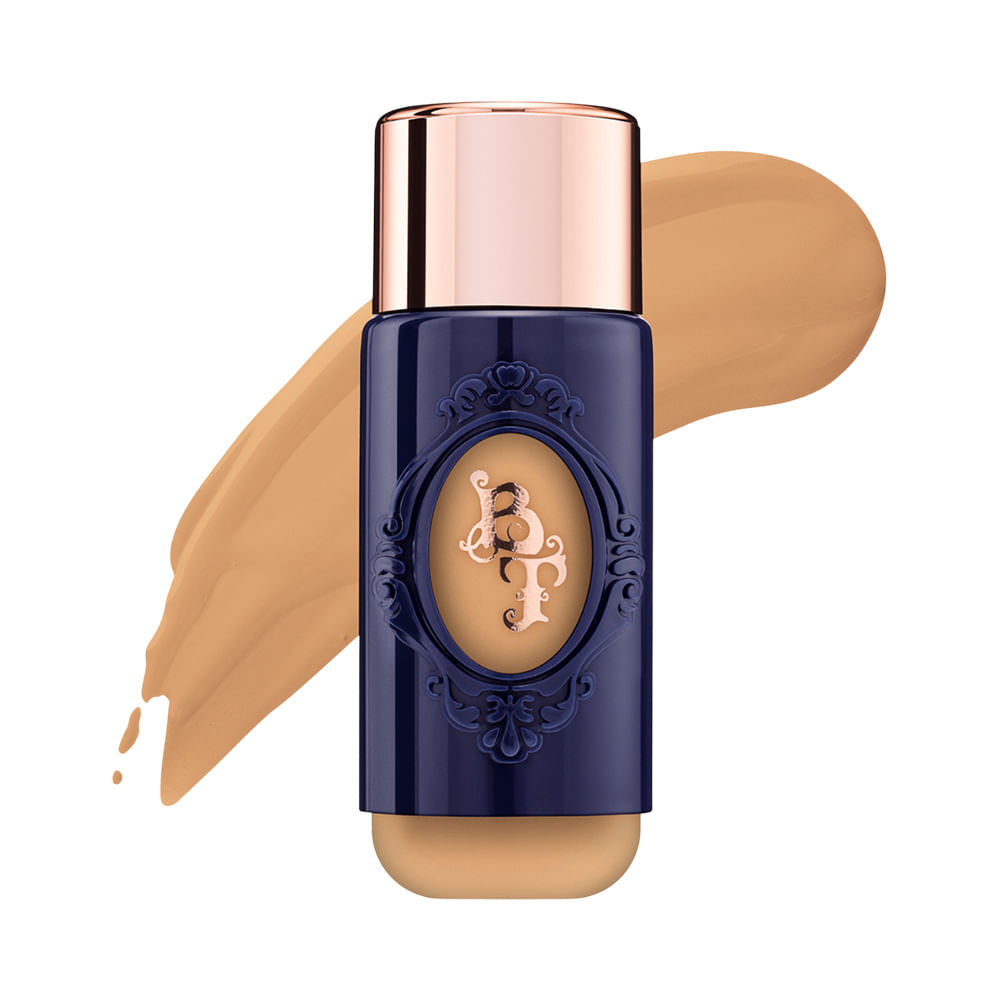 Base Líquida Bruna Tavares BT Skin Foundation M10 em frasco azul escuro com tampa rosê dourada e amostra da base em tom bege médio